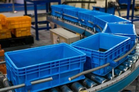 tote boxes on a conveyor belt