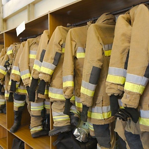 Firefighter uniforms on rack