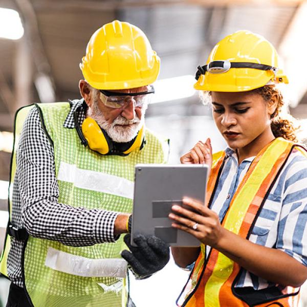 Workers looking at a tablet