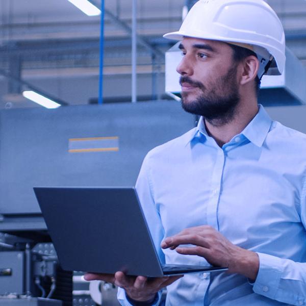 Manufacturing worker with clipboard